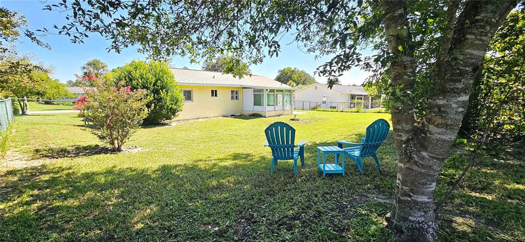 8274 Southwest 106th Place Ocala, FL 34481 - Photo 21 of 40 a view of a house with a swimming pool and sitting area