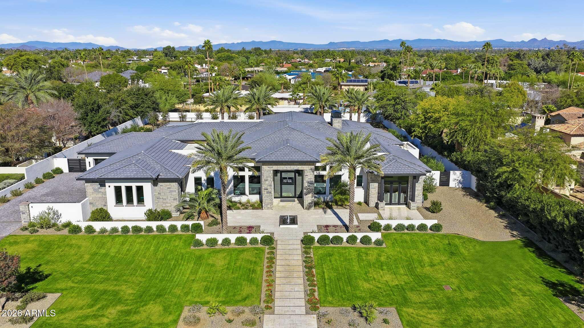 5102 East Butler Drive Paradise Valley, AZ 85253 - Photo 102 of 111 an aerial view of residential houses with outdoor space and trees