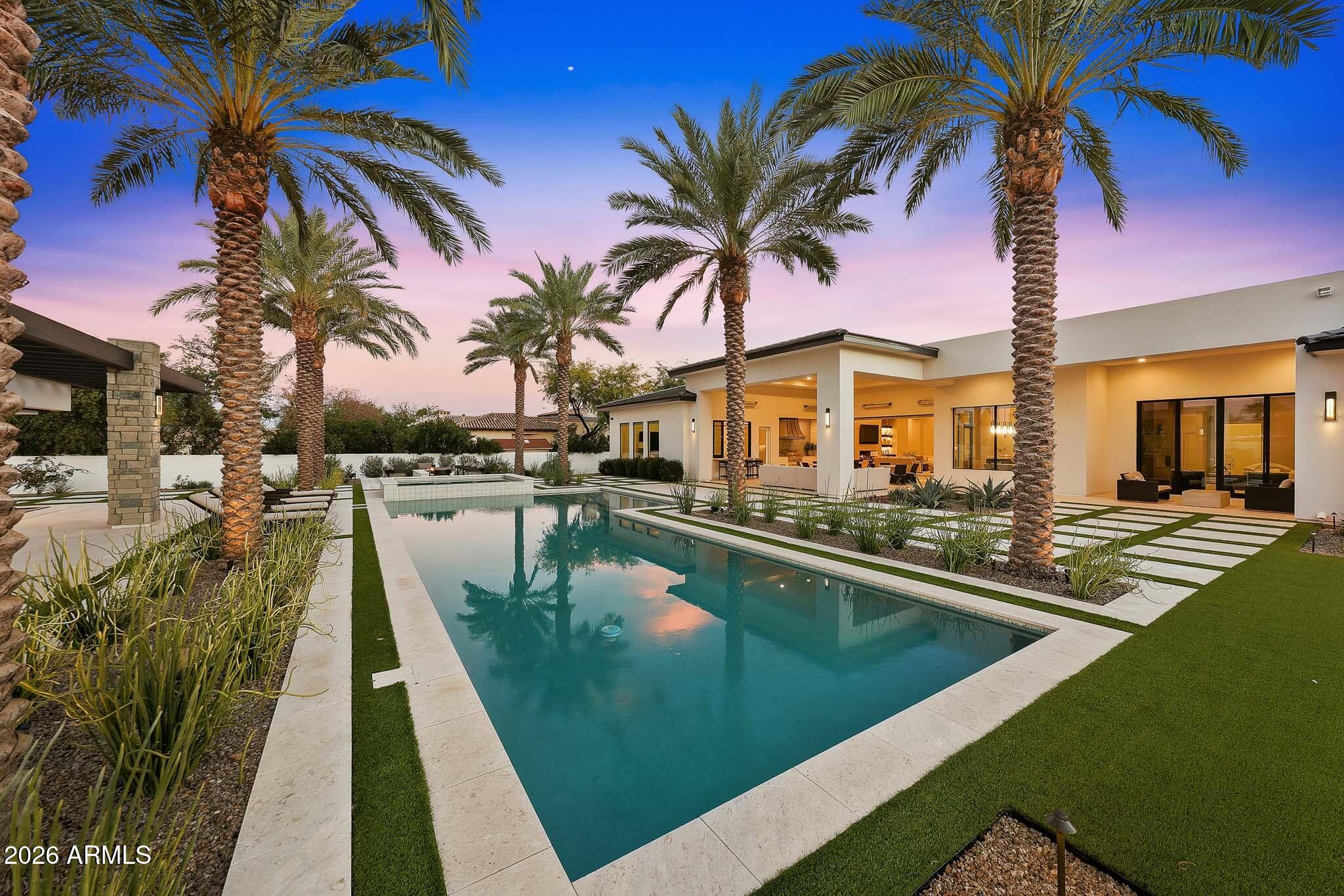5102 East Butler Drive Paradise Valley, AZ 85253 - Photo 47 of 111 a view of swimming pool with a table and chairs under an umbrella