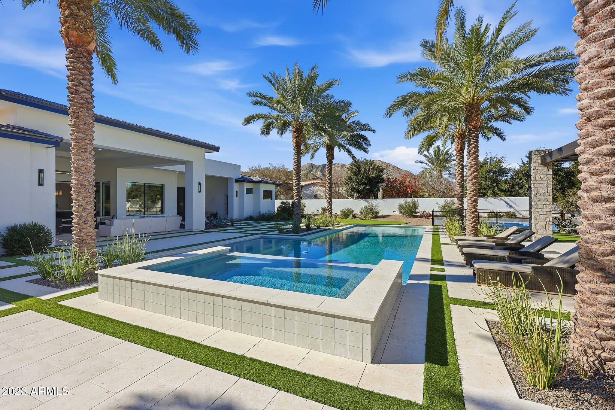 5102 East Butler Drive Paradise Valley, AZ 85253 - Photo 88 of 111 a view of a house with swimming pool and sitting area