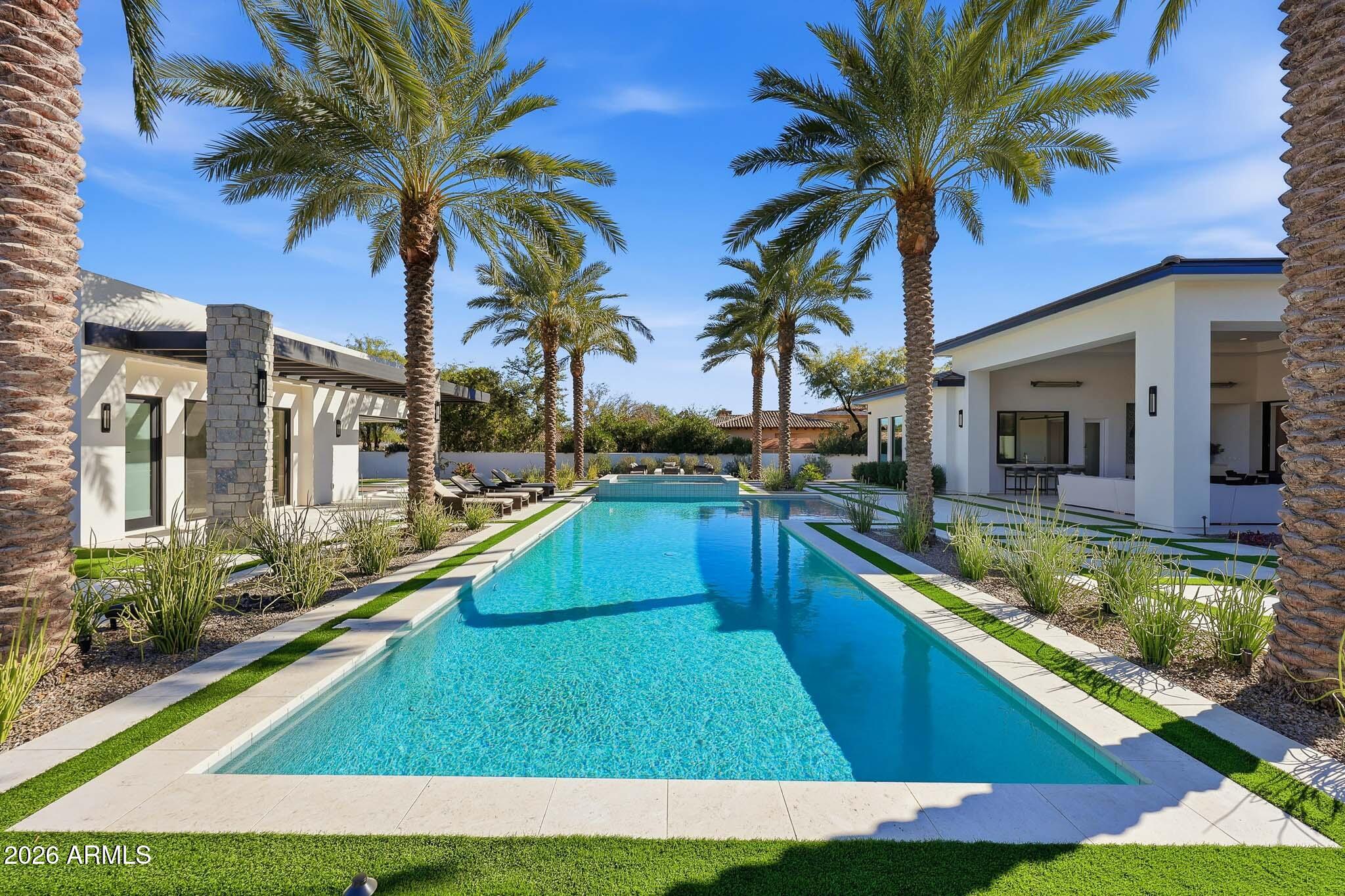 5102 East Butler Drive Paradise Valley, AZ 85253 - Photo 90 of 111 a swimming pool with outdoor seating and yard