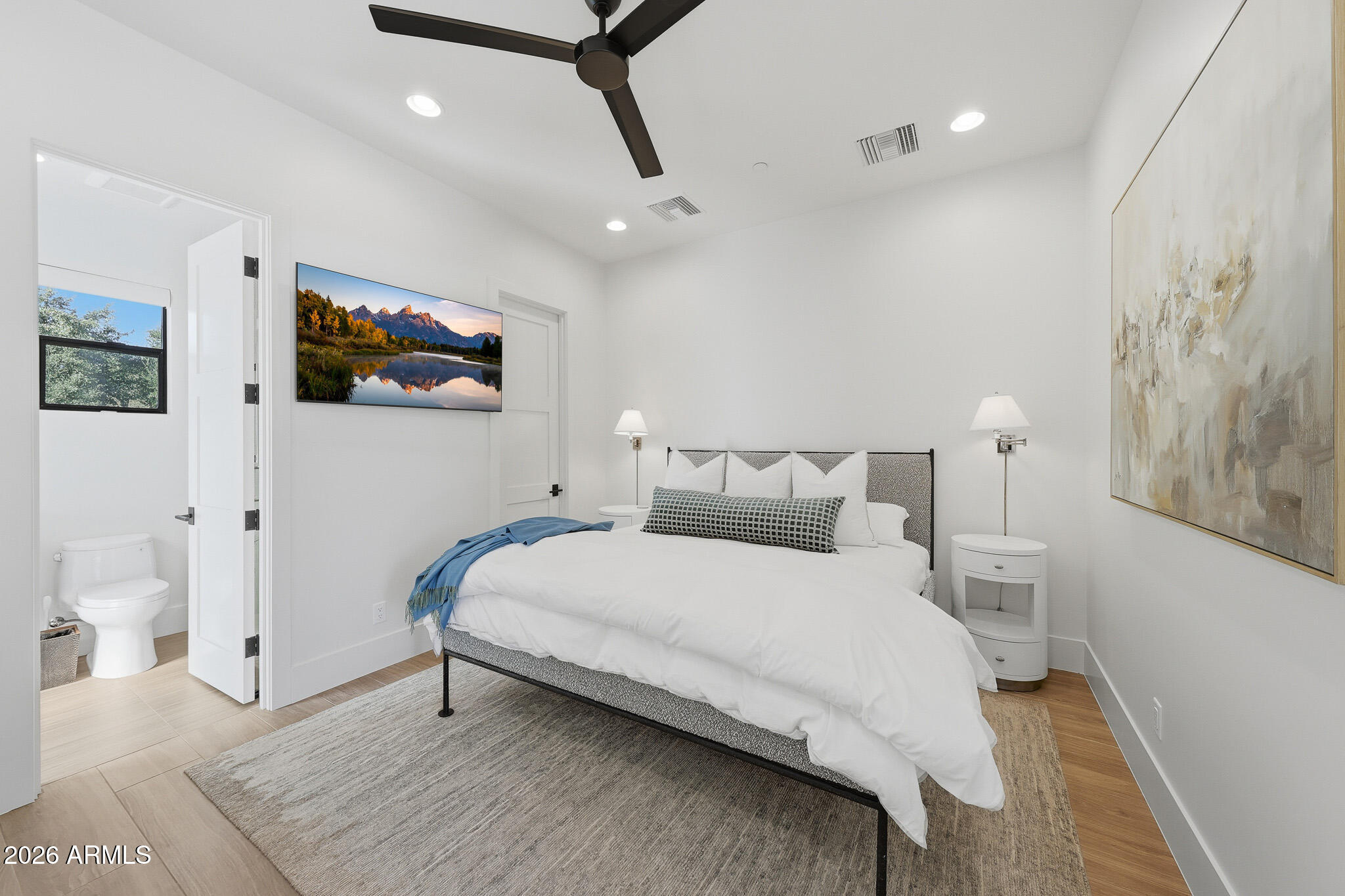 5102 East Butler Drive Paradise Valley, AZ 85253 - Photo 98 of 111 a bedroom with a bed and a flat screen tv