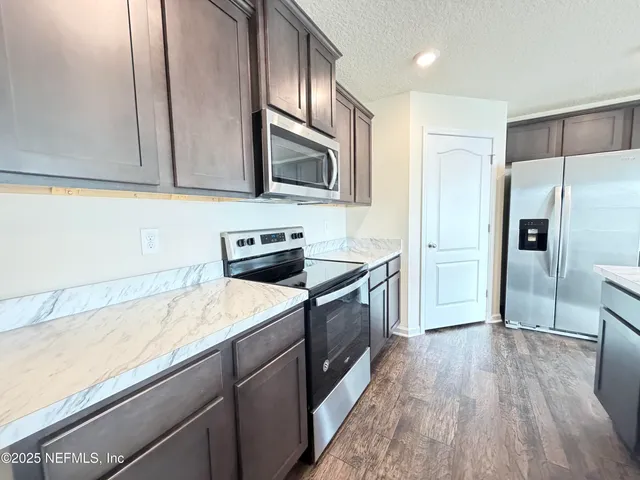 a view of a swimming pool with outdoor seating