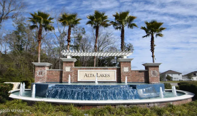 an aerial view of a house with a lake view