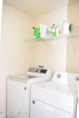 a utility room with dryer and washer