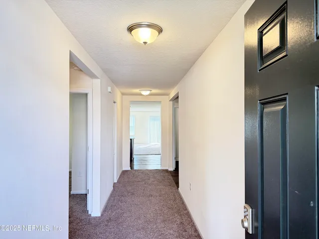 an empty room with a empty space and window