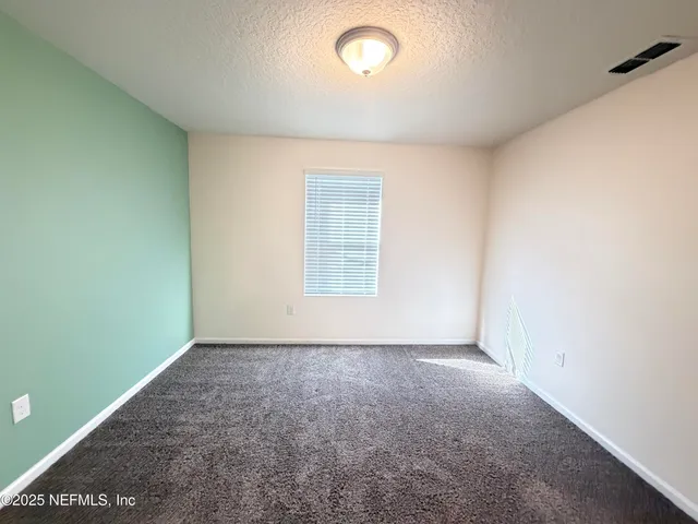 a front view of a house with yard