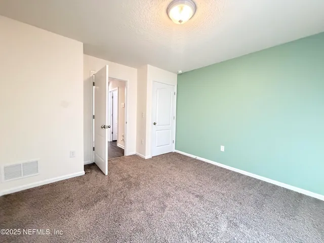 a view of a porch with a table and chair