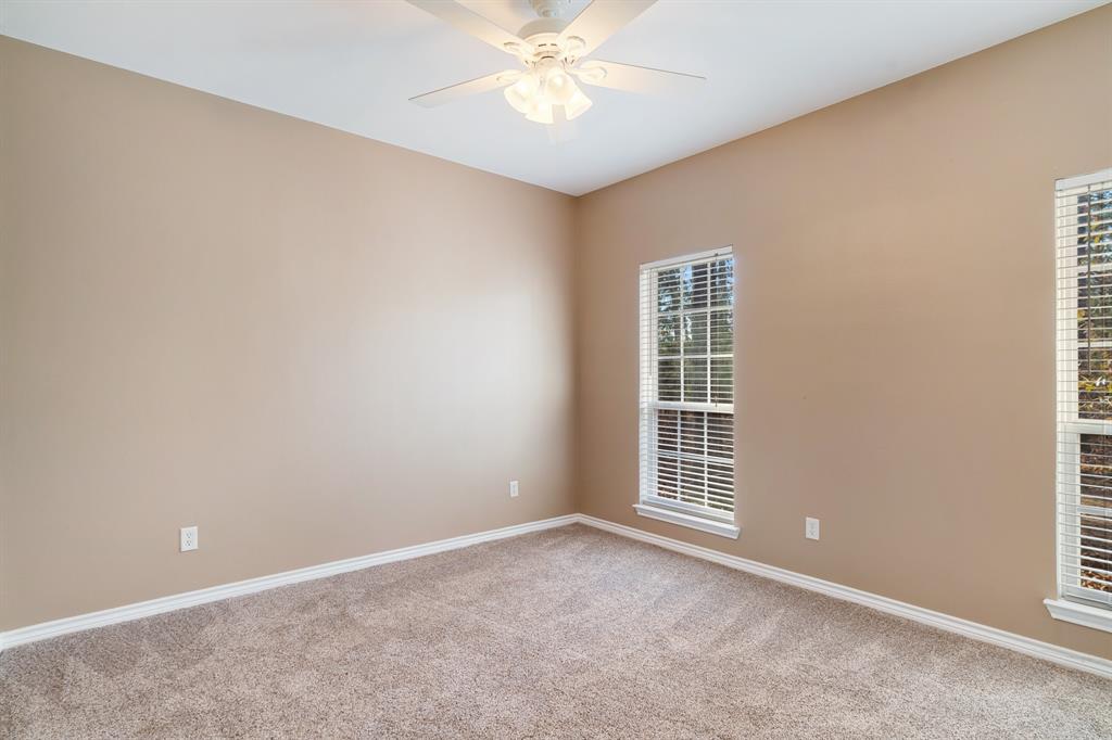 126 Hidden Lake Drive Powderly, TX 75473 - Photo 14 of 29 an empty room with a window and a ceiling fan