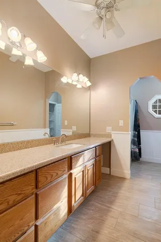 a bathroom with a double vanity sink and a mirror