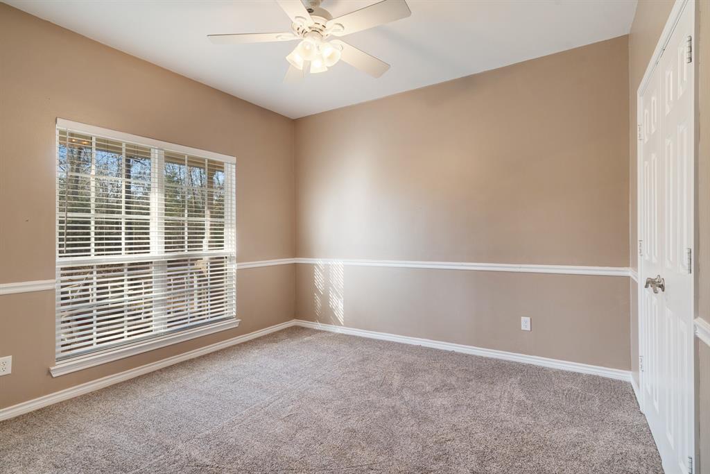 126 Hidden Lake Drive Powderly, TX 75473 - Photo 18 of 29 a view of an empty room with a window