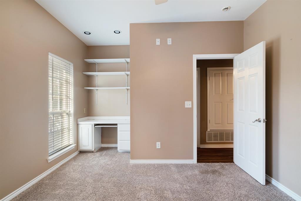 126 Hidden Lake Drive Powderly, TX 75473 - Photo 21 of 29 an empty room with windows and fireplace