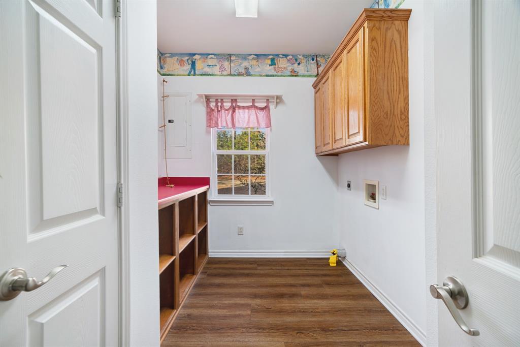 126 Hidden Lake Drive Powderly, TX 75473 - Photo 22 of 29 a view of a hallway with wooden floor and staircase