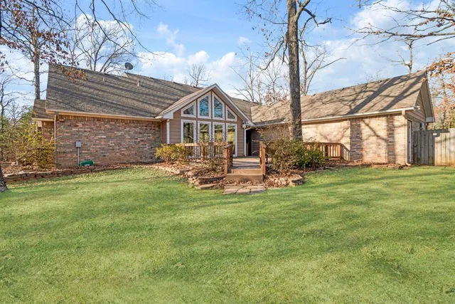 a view of a house with a yard porch and sitting area