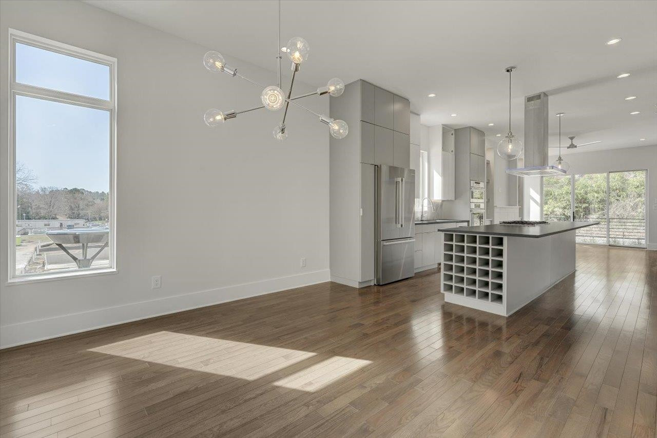 749 Willard Street, Unit 7 Durham, NC 27701 - Photo 11 of 43 a view of an empty room with wooden floor and a window