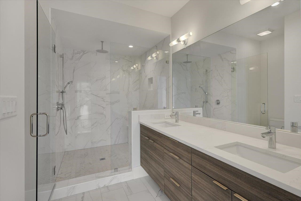 749 Willard Street, Unit 7 Durham, NC 27701 - Photo 20 of 43 a bathroom with a shower sink and mirror