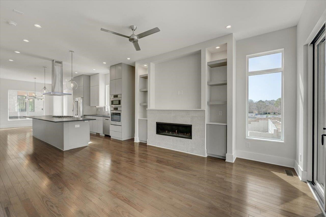 749 Willard Street, Unit 7 Durham, NC 27701 - Photo 3 of 43 a open kitchen with white cabinets and white appliances