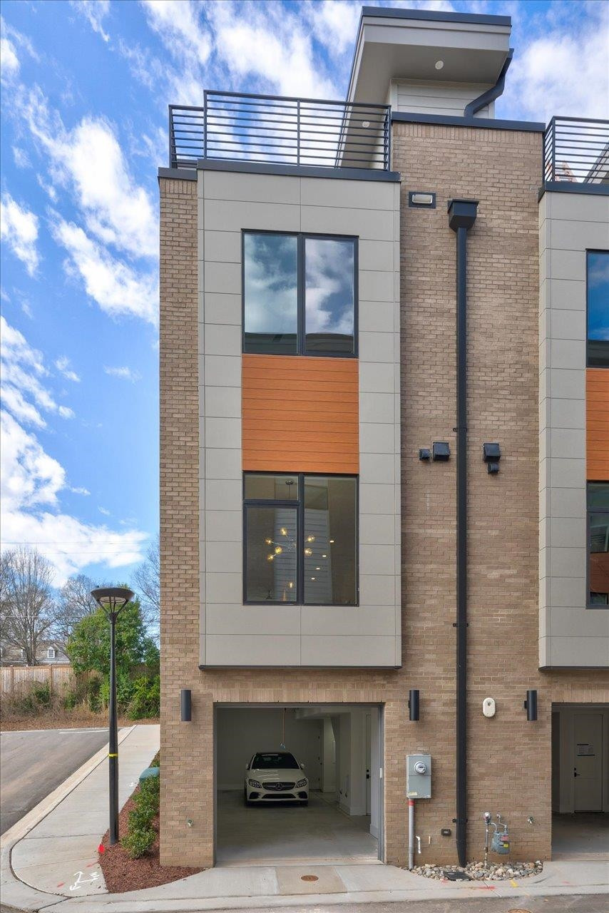 749 Willard Street, Unit 7 Durham, NC 27701 - Photo 32 of 43 a front view of a house with a porch