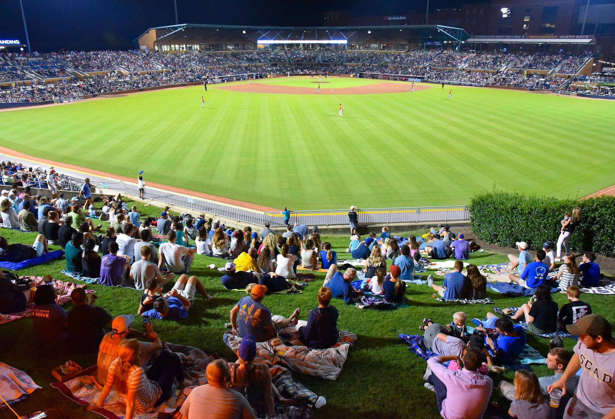 749 Willard Street, Unit 7 Durham, NC 27701 - Photo 41 of 43 a group of people standing around a fruit stand