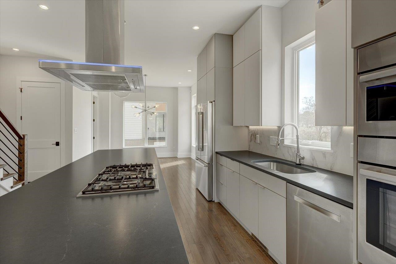 749 Willard Street, Unit 7 Durham, NC 27701 - Photo 8 of 43 a kitchen with a sink stove and refrigerator
