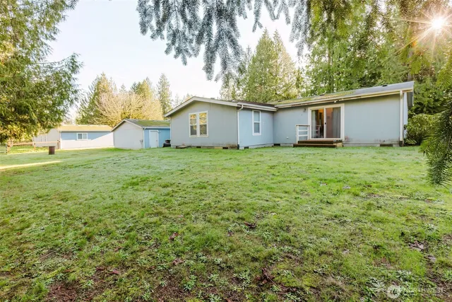 a house with a tree in front of it