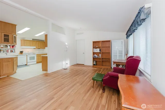 a bed room with a bed and a chair