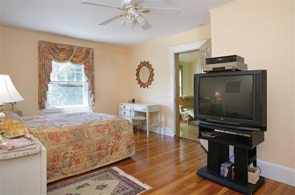 59 Stuart Road Newton, MA 02459 - Photo 5 of 5 a bedroom with furniture and a flat screen tv