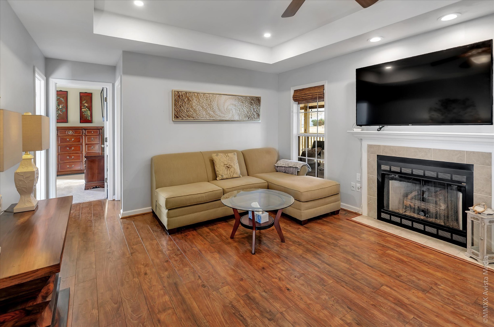 800 Blakemore Road Dickson, TN 37055 - Photo 12 of 28 a living room with furniture a flat screen tv and a fireplace