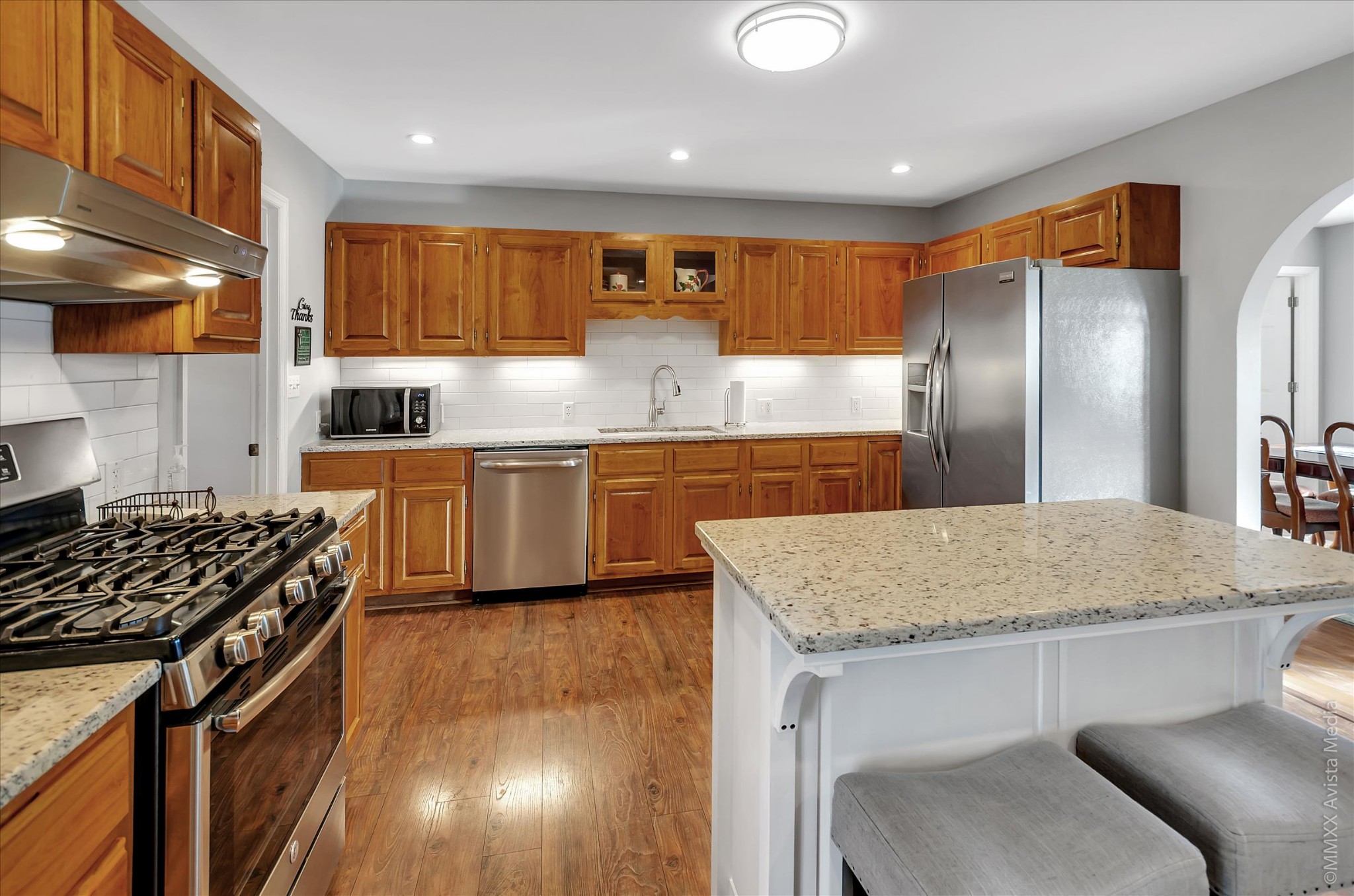 800 Blakemore Road Dickson, TN 37055 - Photo 15 of 28 a kitchen with stainless steel appliances granite countertop a sink stove and refrigerator