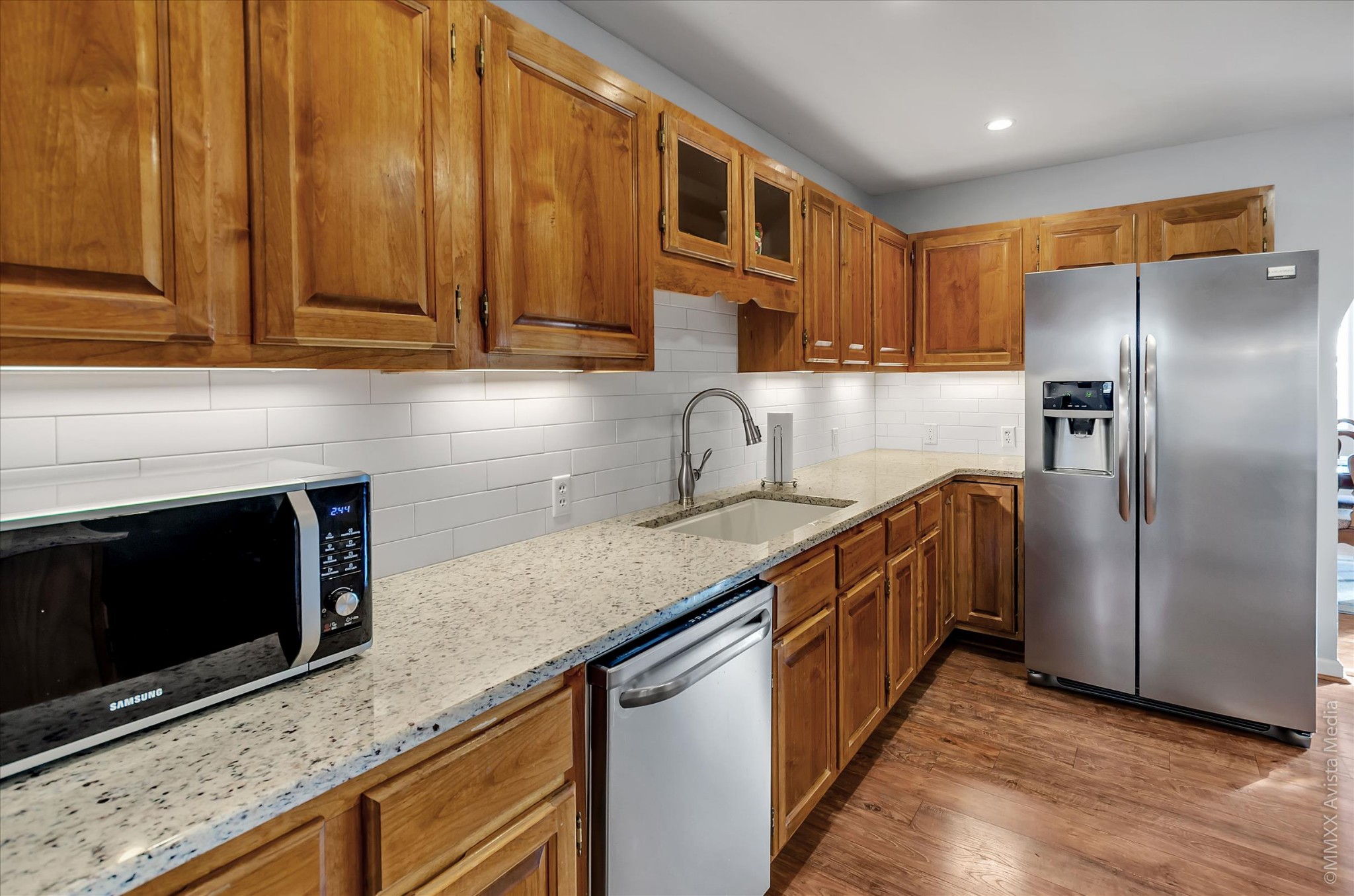 800 Blakemore Road Dickson, TN 37055 - Photo 16 of 28 a kitchen with stainless steel appliances granite countertop a stove a sink and a microwave