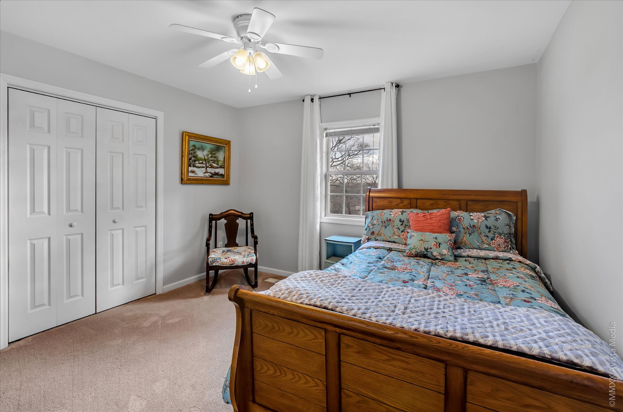 800 Blakemore Road Dickson, TN 37055 - Photo 23 of 28 a bedroom with a bed and a chandelier