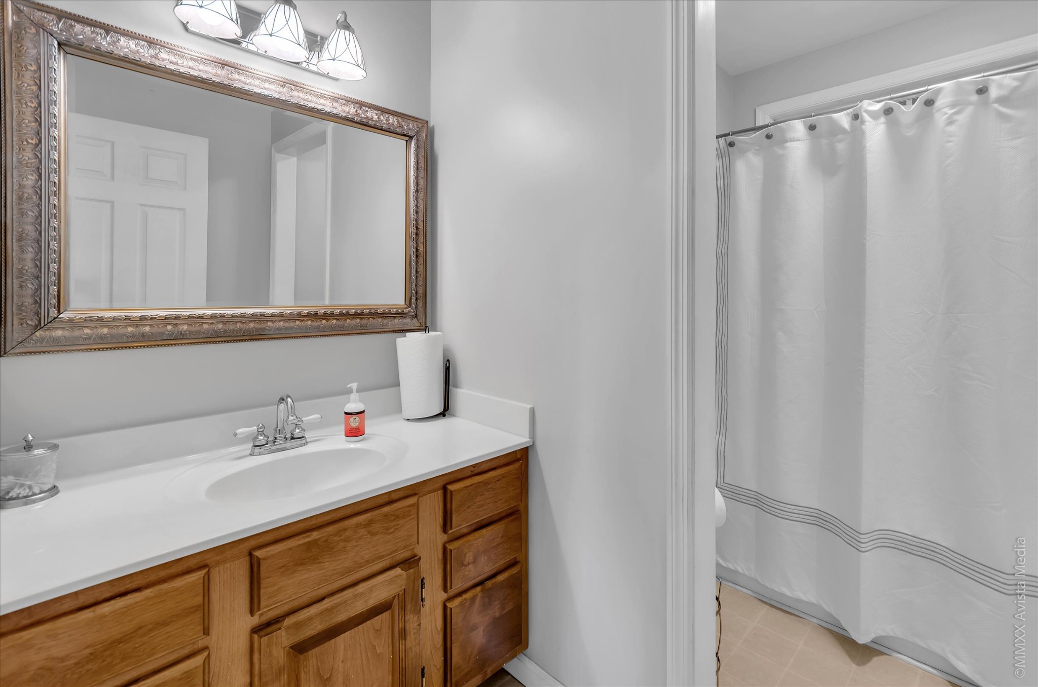 800 Blakemore Road Dickson, TN 37055 - Photo 24 of 28 a bathroom with a sink and a mirror