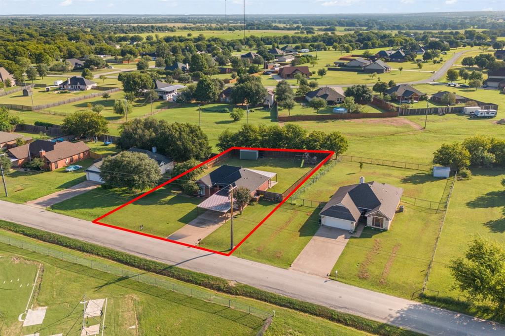an aerial view of a house with a ocean view