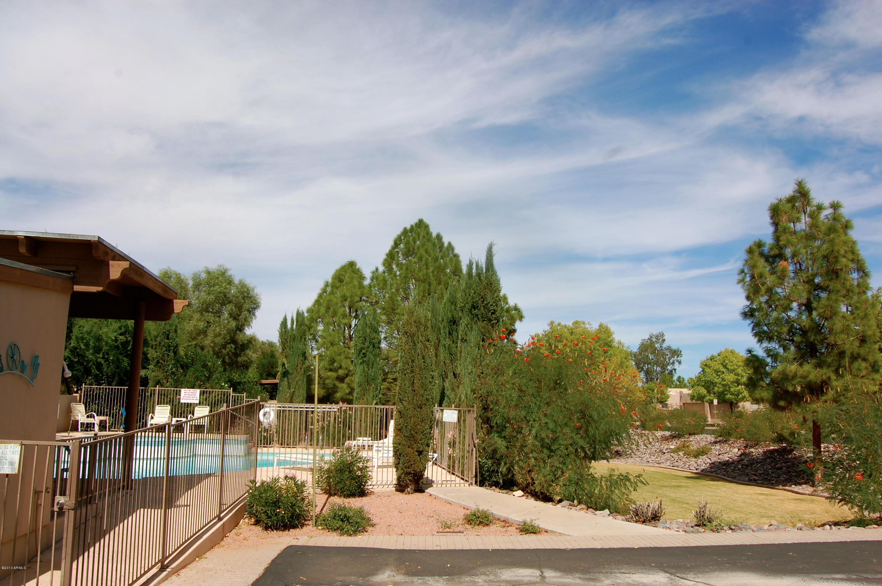 5445 East McKellips Road, Unit 28 Mesa, AZ 85215 - Photo 39 of 40 Pool & Greenbelt across from driveway