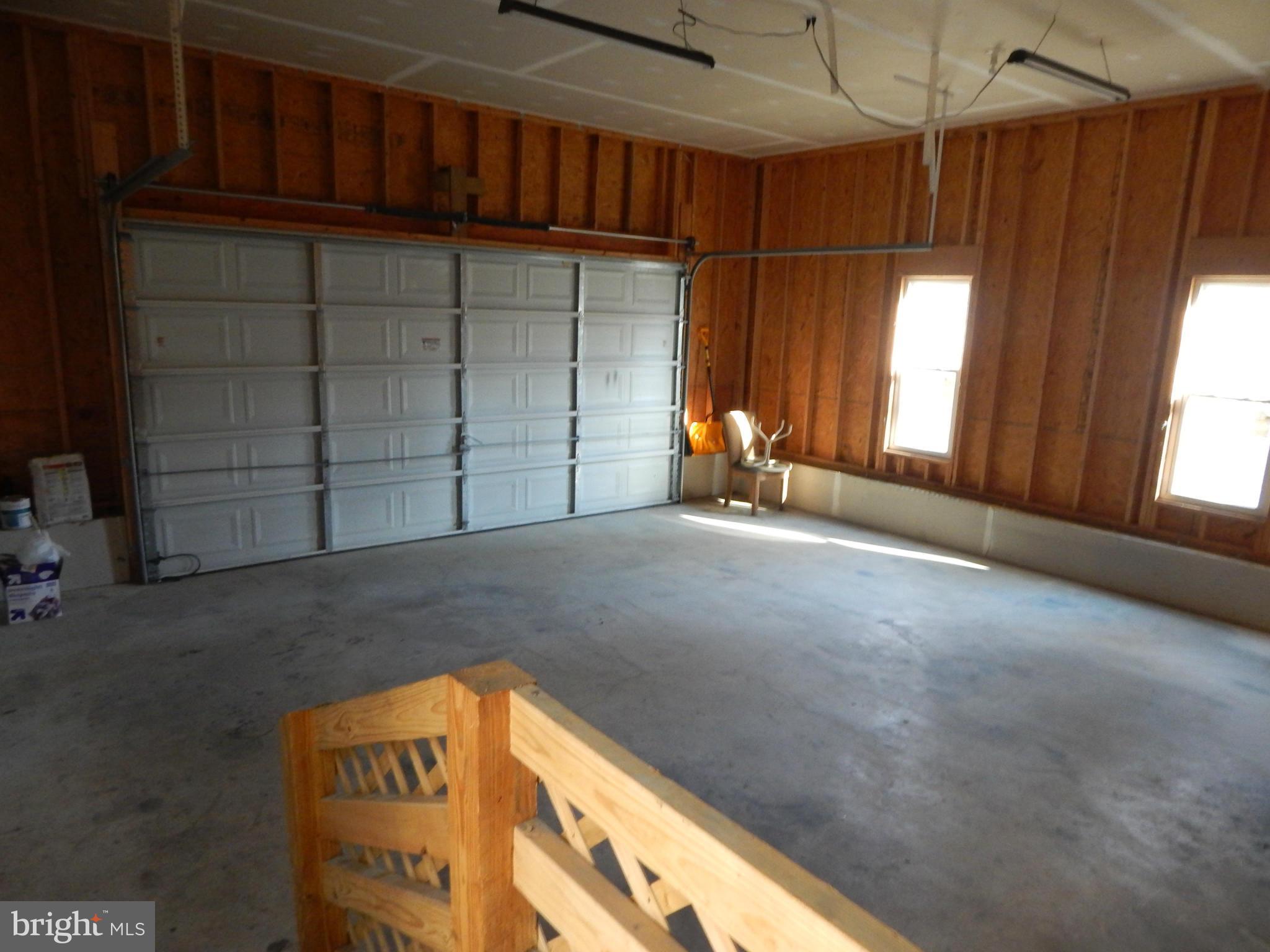 159 Cove Point Road Lusby, MD 20657 - Photo 26 of 26 two car garge high ceilings