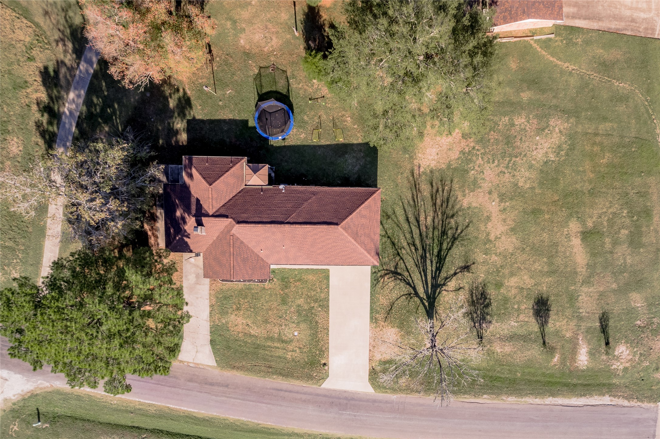 64 Coral Gables Trinity, TX 75862 - Photo 18 of 18 a front view of a house with a yard