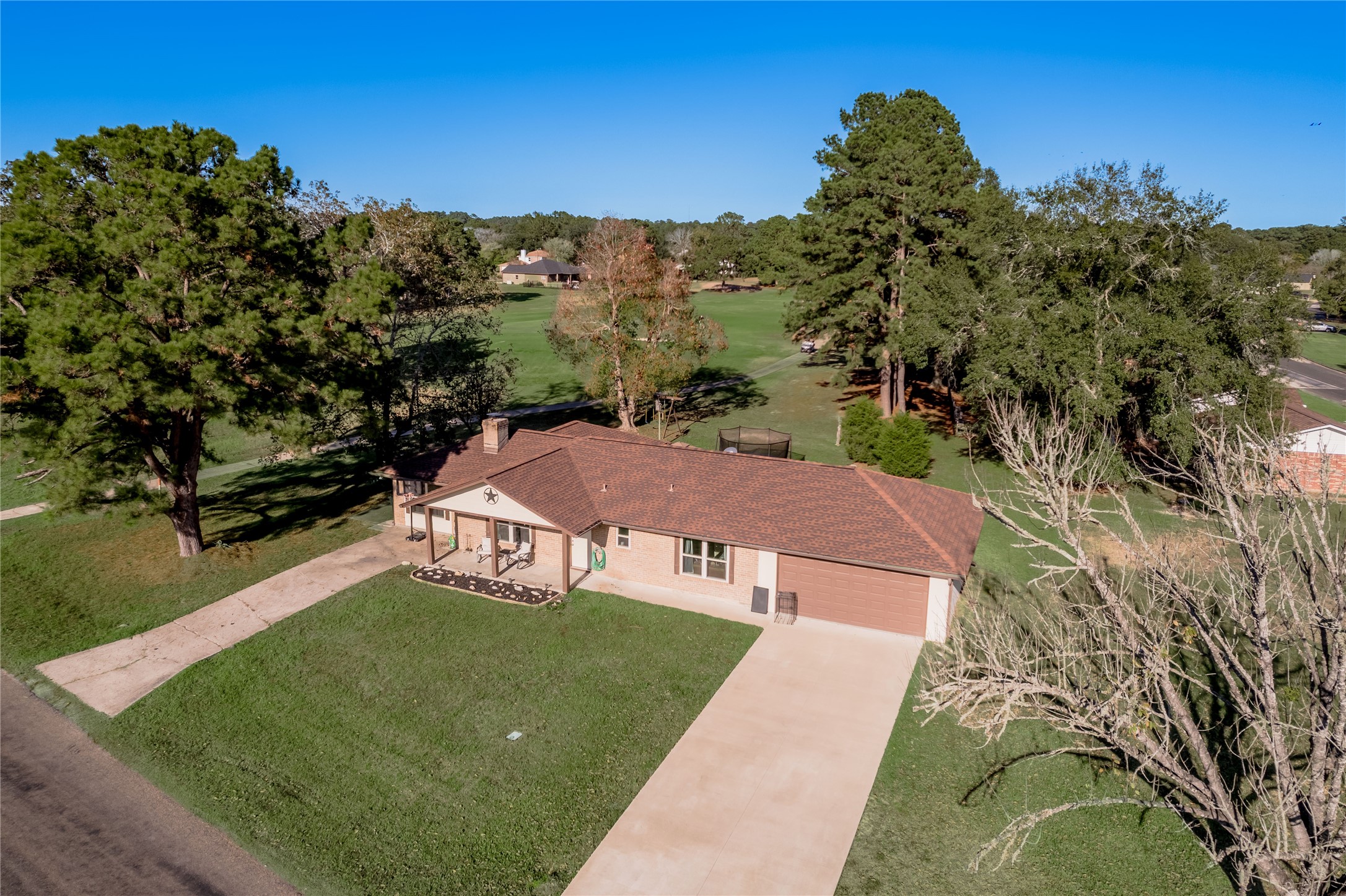 64 Coral Gables Trinity, TX 75862 - Photo 3 of 18 aerial view of a house with a yard