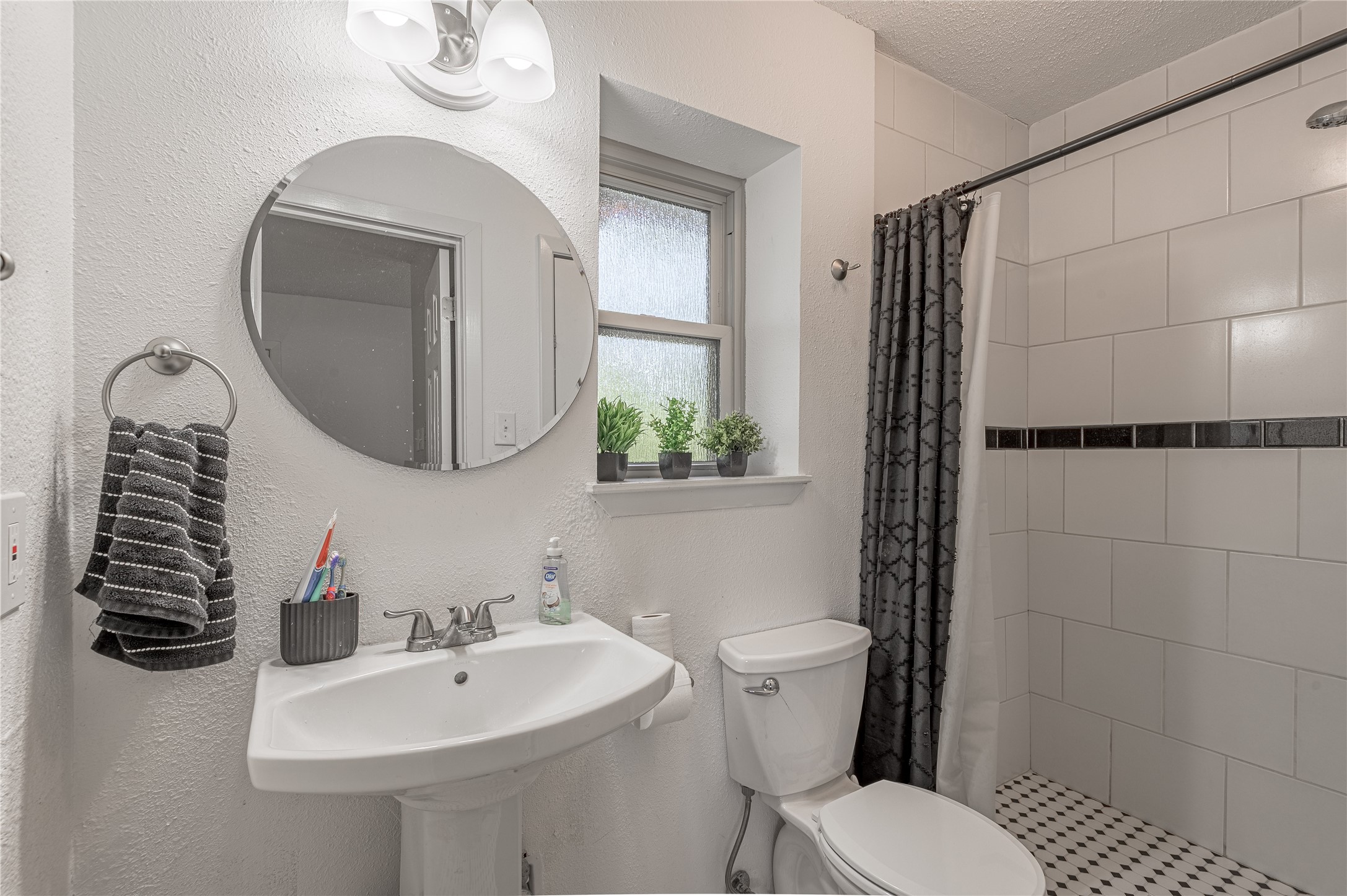 64 Coral Gables Trinity, TX 75862 - Photo 9 of 18 a bathroom with a toilet sink and mirror