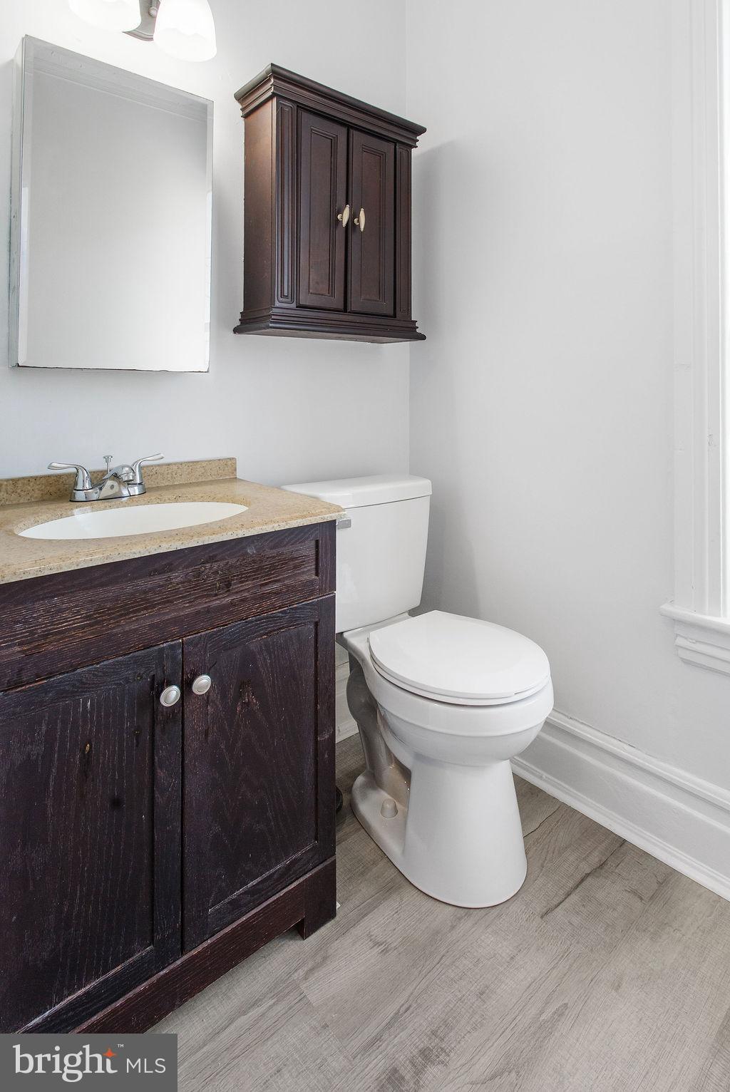 3 Sprenkle Avenue Hanover, PA 17331 - Photo 21 of 28 a bathroom with a granite countertop toilet sink and mirror
