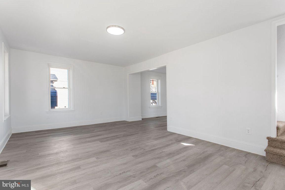 3 Sprenkle Avenue Hanover, PA 17331 - Photo 4 of 28 an empty room with wooden floor and windows