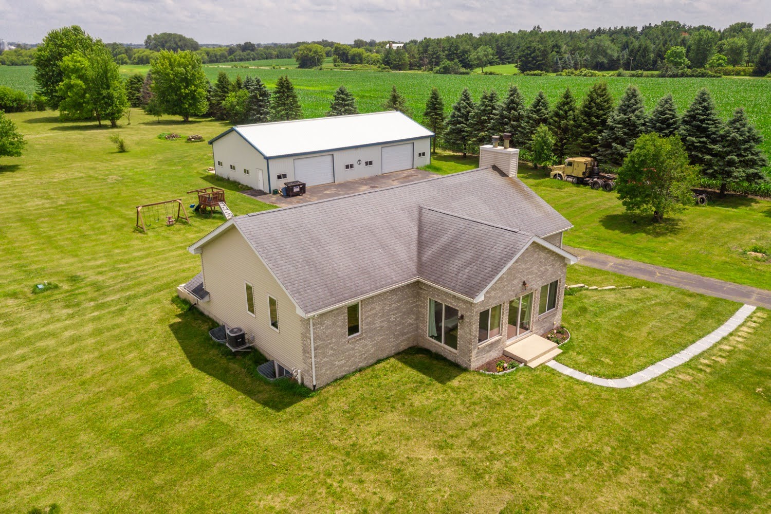 16649 Beaverton Road Capron, IL 61012 - Photo 4 of 48 a aerial view of a house with a big yard and large trees
