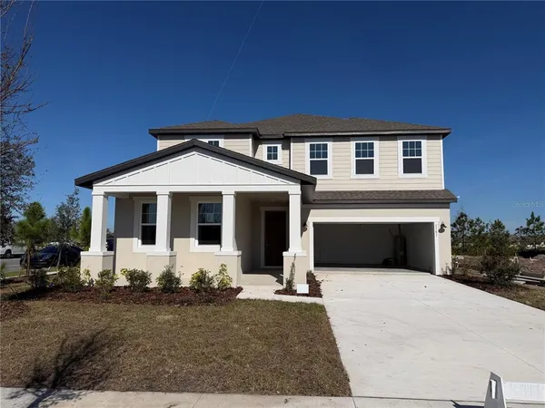 a front view of a house with yard