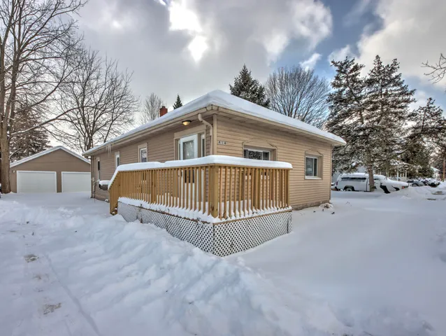 a view of a house with a yard in front of it