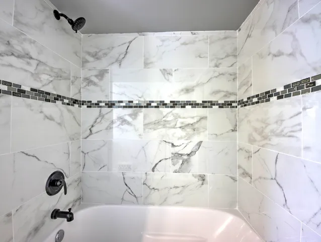 a bathroom with a shower curtain