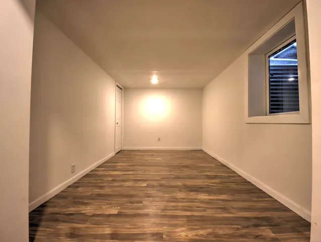 a view of an empty room and window