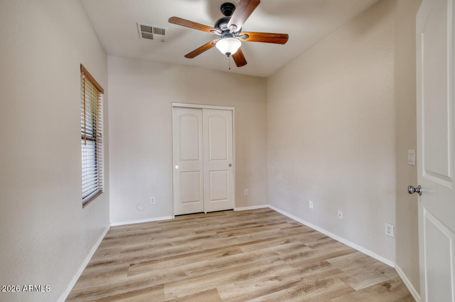 2565 South Signal Butte Road, Unit 46 Mesa, AZ 85209 - Photo 31 of 41 a view of a livingroom with a ceiling fan and window