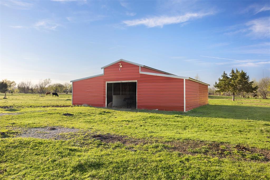 6524 Fair Road Kaufman, TX 75142 - Photo 25 of 30 a yellow house with a yard