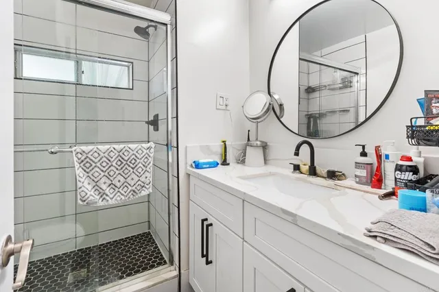 a bathroom with a sink and a mirror