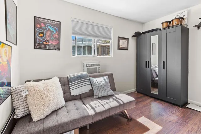 a bedroom with furniture and a window