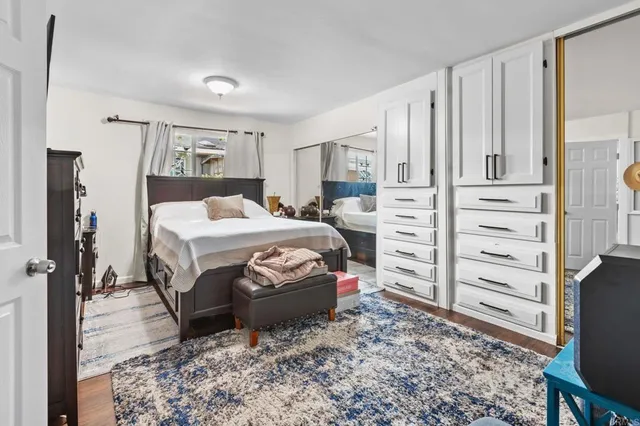 a bedroom with a bed and a closet